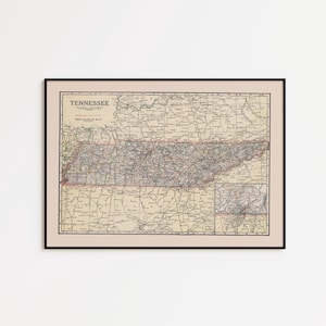 May include: Framed vintage map of Tennessee, featuring detailed road networks and geographical features. The map is in a black frame, with the state name at the top. The map's color palette includes beige, red, and green.