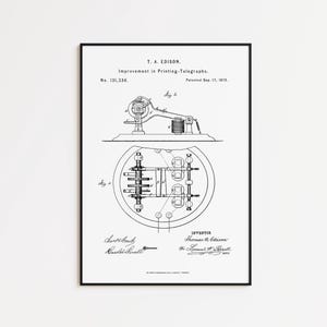 May include: A framed black and white patent print titled T. A. Edison Improvement in Printing-Telegraphs No. 131,336 Patented Sep. 17, 1872. The document features technical line drawings labeled Fig 1 and Fig 2, with signatures at the bottom.