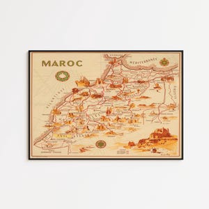 Peut inclure: Carte vintage encadrée du Maroc, avec des illustrations détaillées de monuments et de villes. La carte est dans des tons beige, marron et rouge, avec le mot "MAROC" en haut. La carte est encadrée dans un cadre noir.