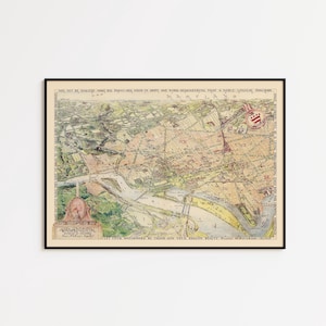 May include: A framed vintage map of Washington, D.C., in a black frame. The map features detailed illustrations of the city's layout, with text and artistic elements. The color palette includes beige, green, and yellow tones.