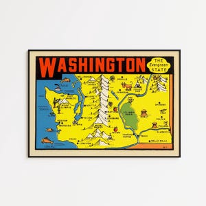 May include: A framed vintage map of Washington State, featuring a yellow and blue color scheme. The word "WASHINGTON" is in large red letters at the top. The map includes cities, mountains, and the text "The Evergreen State."