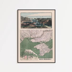May include: Framed vintage map print featuring two detailed illustrations. The top section depicts a coastal scene with ships, while the bottom shows a map of a region with the text "RUSSIA MERIDIONALE". The print is in a black frame.