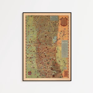 May include: Framed vintage map with a detailed illustration of a region, featuring a network of roads, landmarks, and text. The map is in a black frame, with a cream-colored border. The map's color palette includes shades of brown, green, and red.