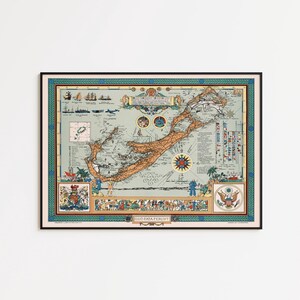 May include: A framed vintage-style map of Bermuda featuring a light tan landmass, blue ocean, and decorative borders. The map includes illustrations of ships, a compass rose, heraldic crests, and the Latin text Quo Fata Ferunt at the bottom.
