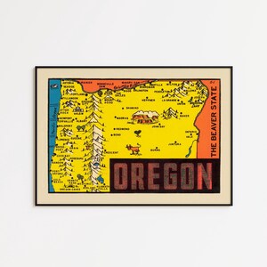 May include: A framed vintage map of Oregon, with a yellow background and a detailed illustration of the state's cities and landmarks. The word "OREGON" is displayed in a red, blocky font.