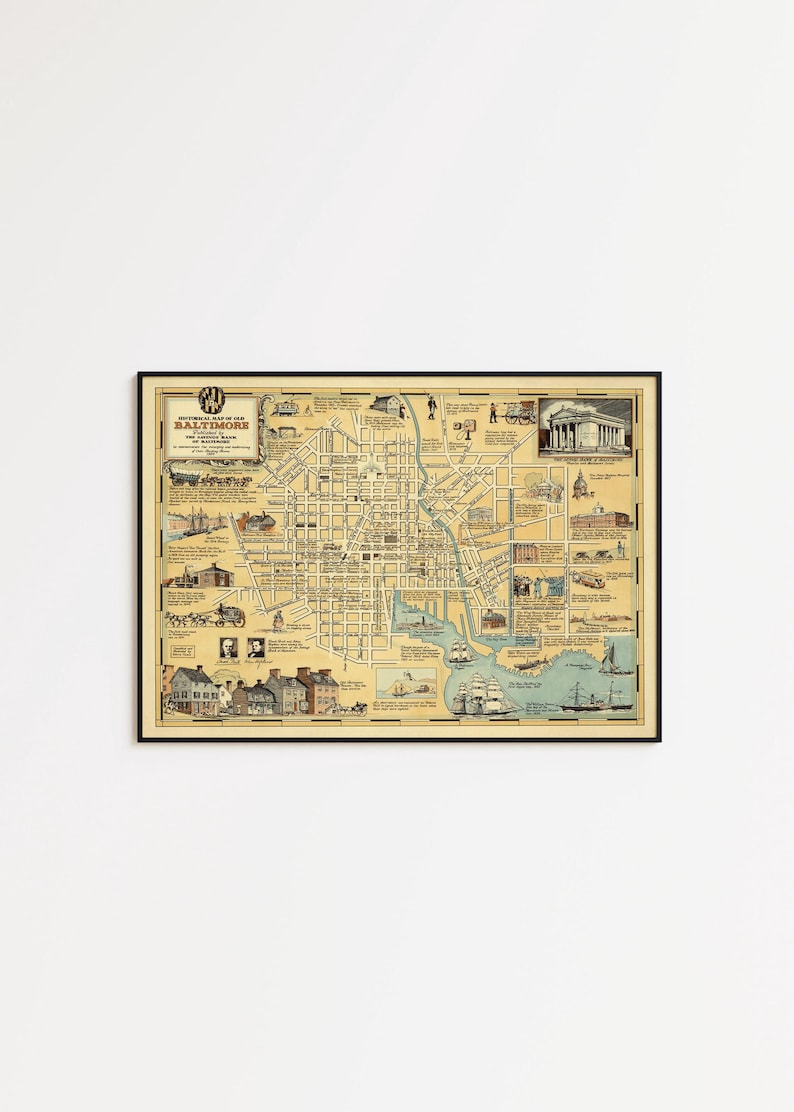 May include: A framed historical map of old Baltimore with a cream-colored background, black grid lines, and various illustrations of buildings, ships, and people. The title reads Historical Map of Old Baltimore Published by the Savings Bank of Baltimore.