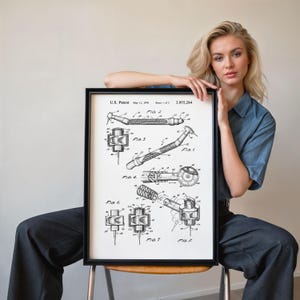 May include: A framed black and white patent print displaying detailed diagrams of a dental tool. The print includes the text "U.S. Patent May 11, 1906" and "3,955,284". The technical drawings illustrate different aspects of the tool's design.