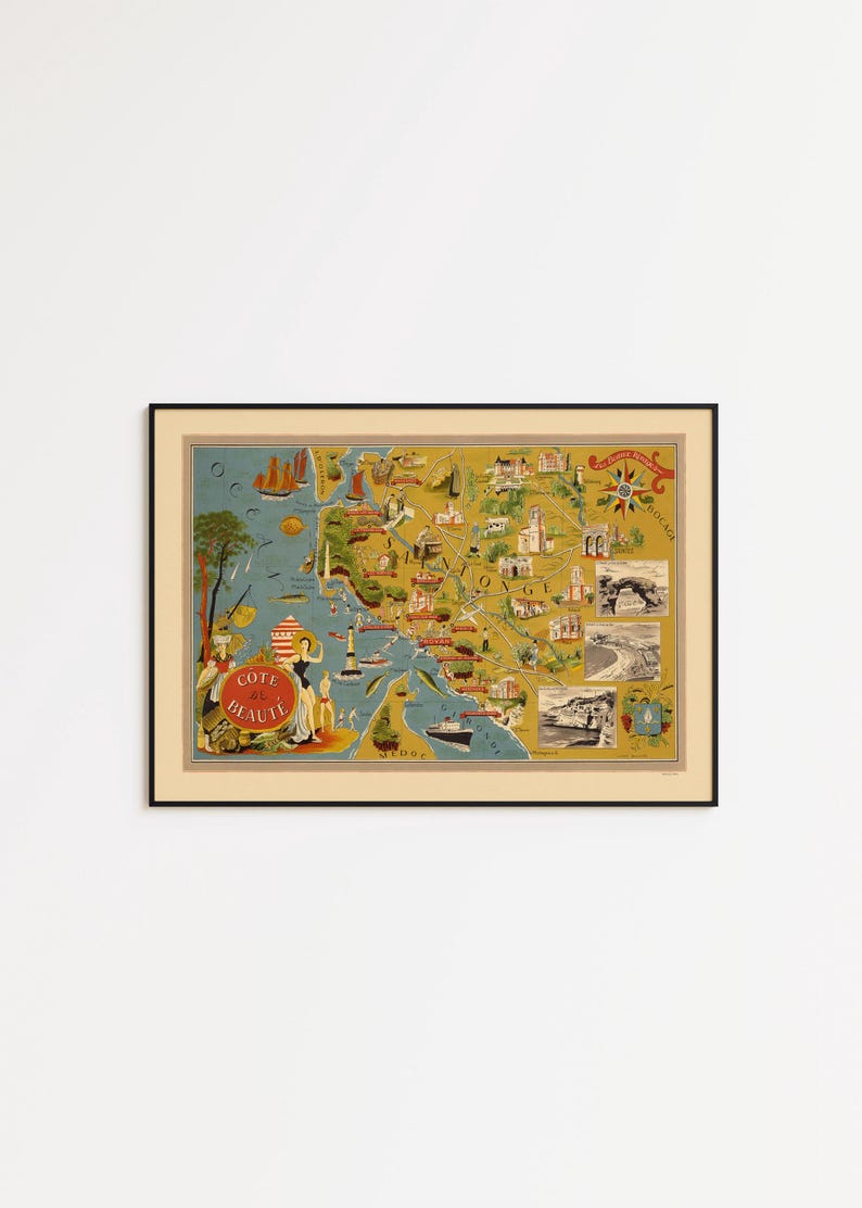 May include: A framed vintage-style pictorial map titled Cote de Beaute, featuring illustrations of coastal landscapes, lighthouses, ships, and local landmarks in shades of yellow, blue, and red, presented in a simple black frame.