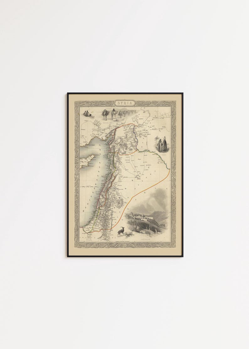 May include: Framed vintage map of Syria, with detailed geographical information and illustrations. The map is in black and white with a decorative border and the word "SYRIA" at the top. The frame is black.