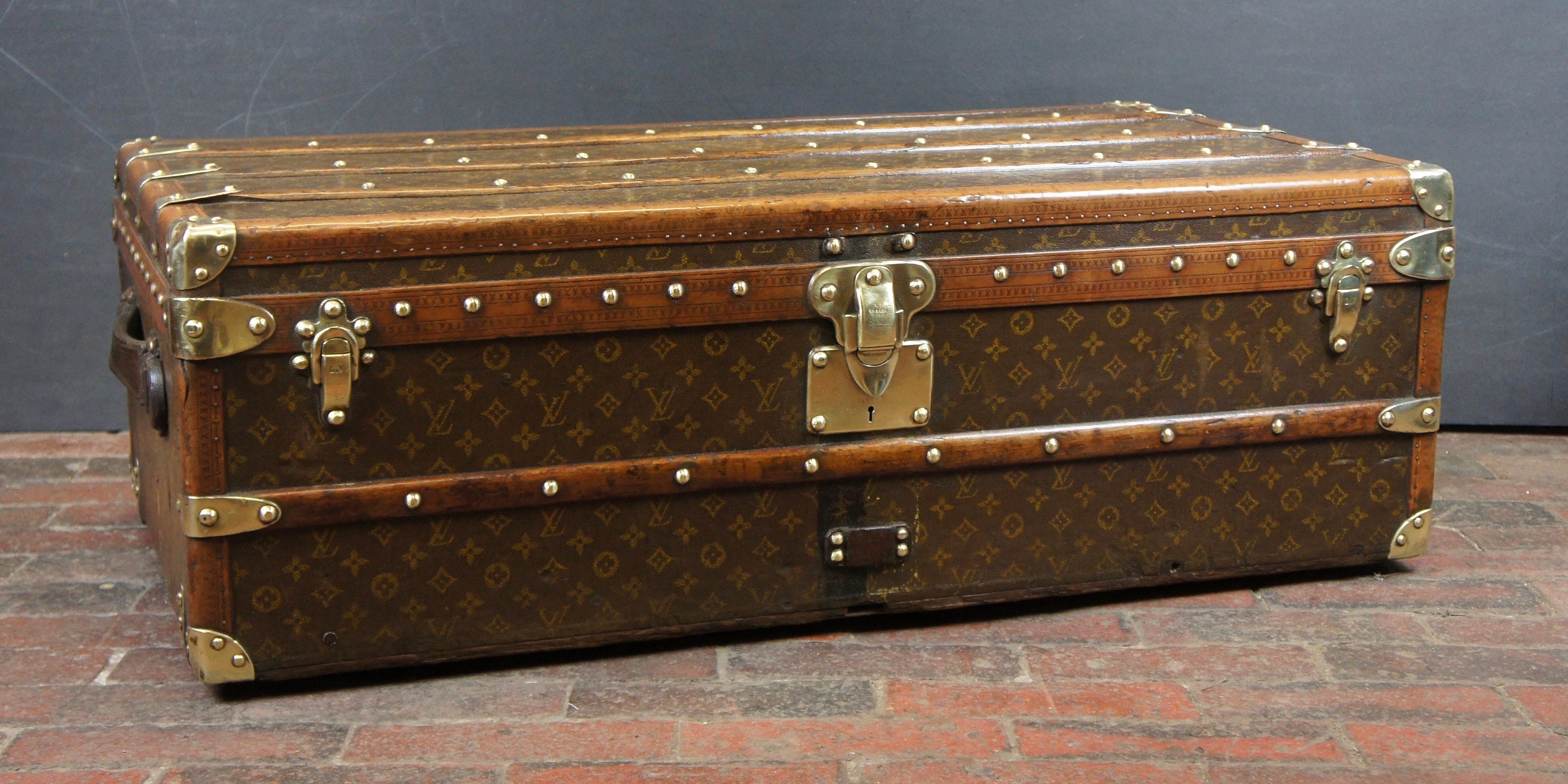 Old Louis Vuitton travel trunk 1920 with monogram - THE HOUSE OF WAUW