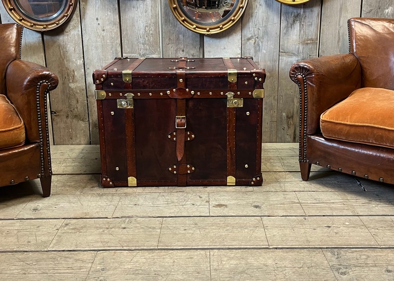 Large dark leather storage chest with antique brass fittings, corner plates and double leather carry straps, handmade in England