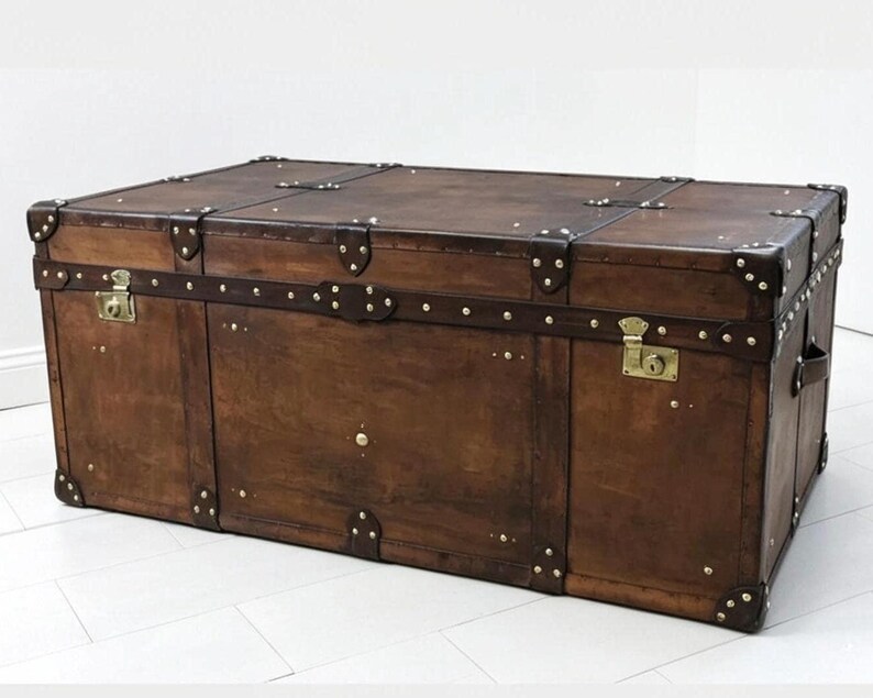 English Artisan Handmade Leather Trunk Vegetable Tan Storage Chest Coffee Table Living Room Furniture Heirloom Quality Brown Chestnut Finish Hand Dyed Unique Character Brass Hardware Accents Large Bedroom Ottoman Wedding Gift Luxury