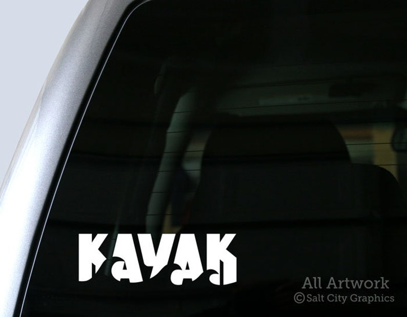 Vinyl decal with the word Kayak shown on truck window