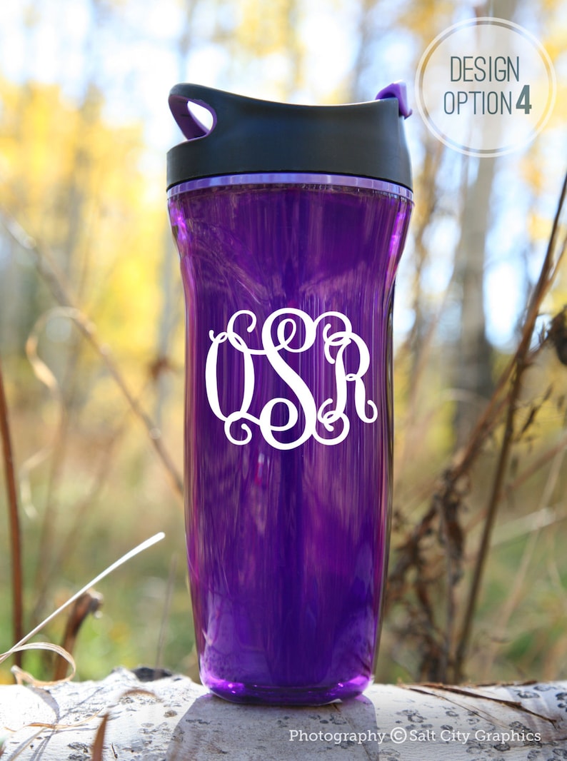 White vinyl decal of script monogram shown on purple water bottle