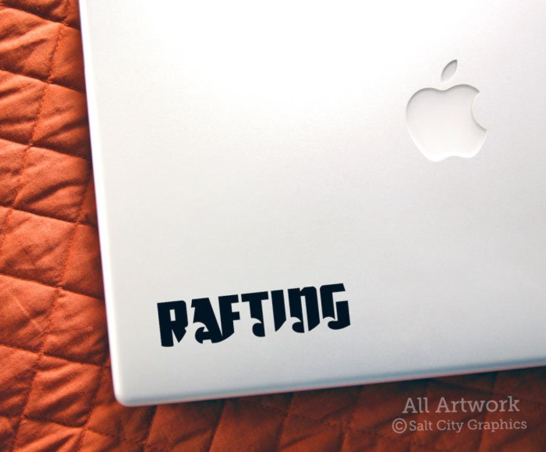 Photo of black vinyl decal of the word Rafting shown on laptop