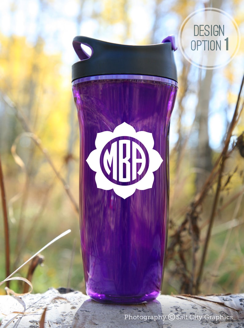 White vinyl decal of flower circle monogram shown on purple water bottle