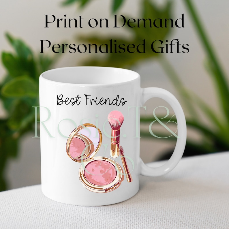 May include: White ceramic mug with a pink and gold makeup brush and compact powder design. The text "Best Friends" is printed on the mug.