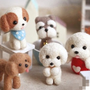 May include: Five needle felted dog figurines. The dogs are brown, white, and gray. They are all sitting or standing on a white surface.