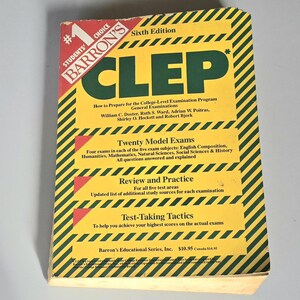 May include: A yellow and green Barron's CLEP study guide, sixth edition, with the title in large green letters. The cover includes text about exam preparation, model exams, review, and test-taking tactics. The book is for college-level examination programs.