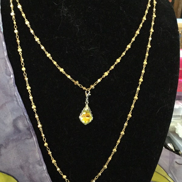 Necklace.  Double strand of gold toned chains displaying Swarovski crystals! This piece looks like something straight from the RED CARPET!