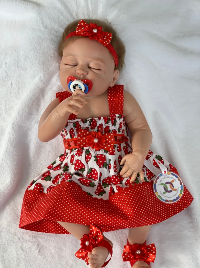 red newborn gown