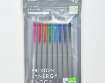 May include: A package of ten Pilot FriXion Synergy Knock retractable gel pens. The pens are silver with a clear barrel and a variety of colored ink refills. The package includes the text "FriXion Synergy Knock" and "0.5 mm".