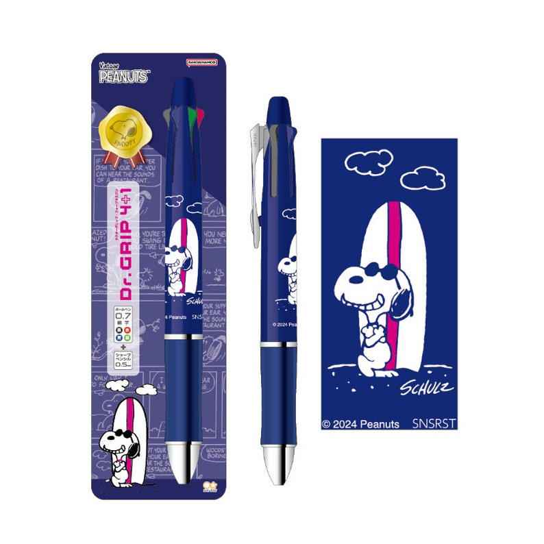 May include: A blue and white pen with a Peanuts character, Snoopy, surfing on a surfboard. The pen is a Dr. Grip 4+1 and has a blue and white design with the Peanuts logo. The text "SCHULZ" and "2024 Peanuts SNSRST" is printed on the pen.