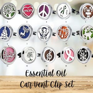 May include: Set of 15 silver car vent clips with various designs, including a tree, a peace sign, a reindeer, a musical note, a snowflake, and a Christmas tree. The clips are designed to hold essential oils.