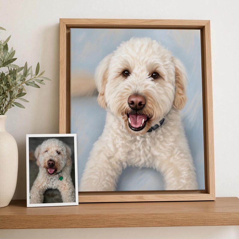 a framed photograph of a white dog with a collar, sitting on a wooden shelf next to a small framed photograph of the same dog.