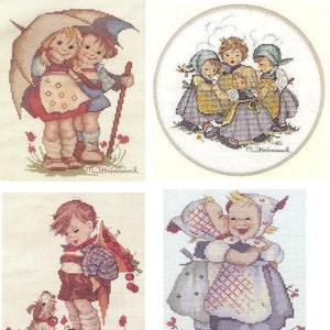 May include: Four cross-stitch patterns featuring children in various scenes. The first pattern shows two children under an umbrella. The second pattern shows a group of children singing. The third pattern shows a child with a dog and a basket of flowers. The fourth pattern shows two children kissing.