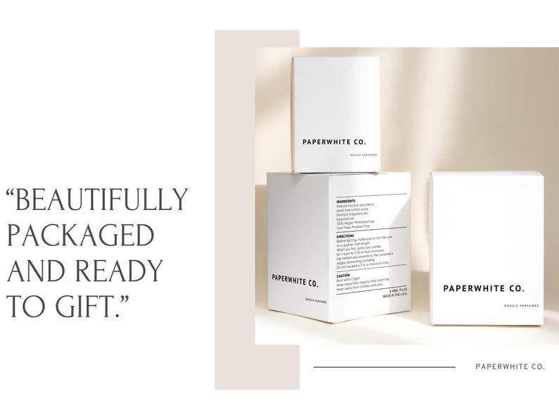May include: Three white boxes with the text "PAPERWHITE CO." on them. The boxes are stacked on top of each other. The top box has the text "SOY WAX CANDLES" on it. The middle box has the text "BRUSHED GOLD" on it. The bottom box has the text "SOY WAX CANDLES" on it. The text "BEAUTIFULLY PACKAGED AND READY TO GIFT." is written in black text on a white background.