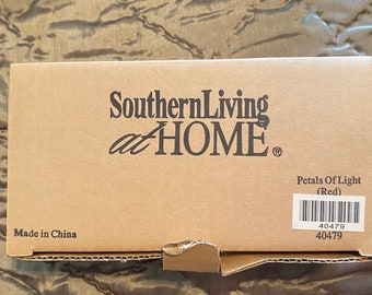 Discontinued Southern Living at Home , tea light candle holders. Never used in original opened box. Petals of light , red.