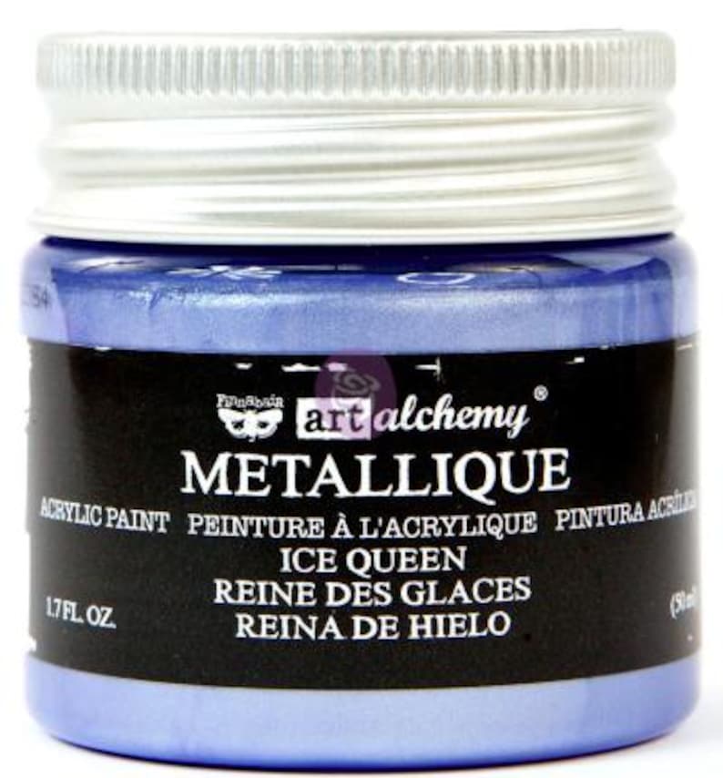 May include: A jar of Finnabair Art Alchemy Metallique acrylic paint in the colour Ice Queen. The jar features a silver screw-top lid and a black label with white text reading Metallique, Ice Queen, and 50 ml. The paint is a metallic blue.