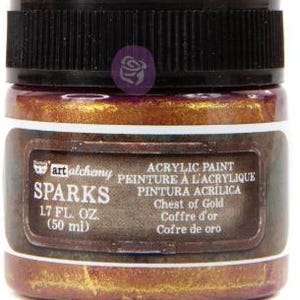 May include: A jar of Art Alchemy Sparks acrylic paint in the colour Chest of Gold. The jar has a black ribbed lid and a label that reads Sparks, 1.7 fl. oz. (50 ml), Acrylic Paint, and Chest of Gold. The paint inside is a metallic gold hue.