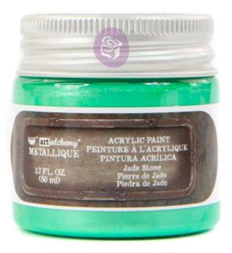 May include: A jar of Art Alchemy Metallique acrylic paint in the colour Jade Stone. The jar has a silver screw-top lid and a label with the text Art Alchemy Metallique, Acrylic Paint, and 1.7 fl. oz. (50 ml). The paint inside is a bright green.