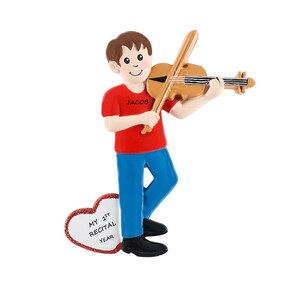May include: A personalized Christmas ornament featuring a boy playing a violin. The ornament is red, blue, and brown. The boy is wearing a red shirt with the name "Jacob" on it. The ornament also includes a heart-shaped tag with the text "My 1st Recital Year".
