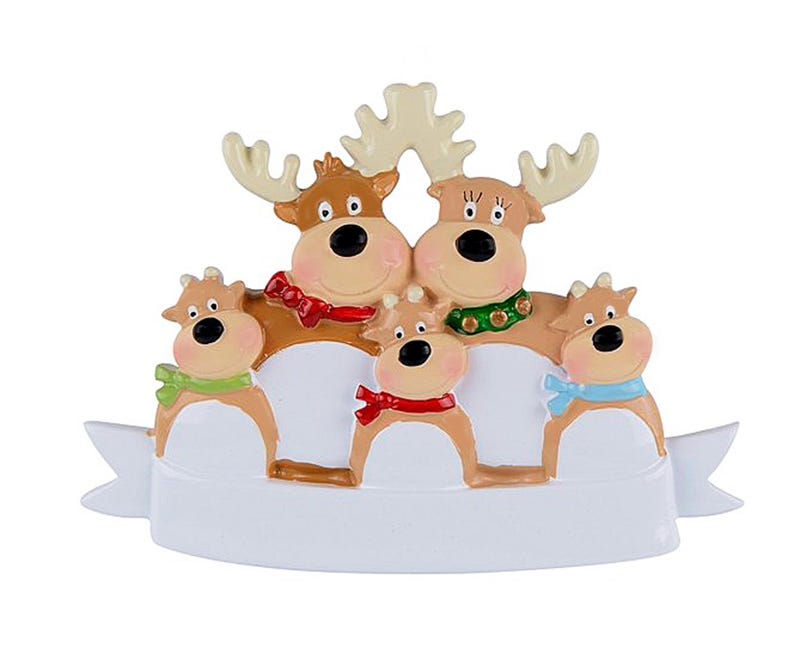 May include: A Christmas ornament featuring a family of five reindeer. The reindeer have brown bodies, large black eyes, and wear colorful scarves. The ornament has a white banner at the bottom.
