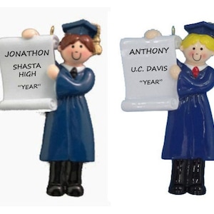 May include: Two blue graduation ornaments with a scroll in their hands. The scroll on the left says "Jonathon Shasta High "Year" and the scroll on the right says "Anthony U.C. Davis "Year"