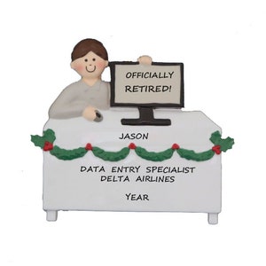 May include: A white ceramic ornament depicting a person sitting at a desk with a computer. The computer screen reads "Officially Retired!" The ornament also includes the text "Jason, Data Entry Specialist, Delta Airlines, Year".