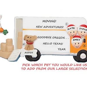 May include: A personalized moving truck ornament with a family of three and a dog named Aspen. The ornament includes a bunny, a cat, and text that reads "Moving! New Adventures! Goodbye Oregon... Hello Texas!"