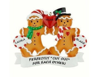 May include: Personalized gingerbread couple Christmas ornament with the text "Perfectly "cut out" for each other!" and the names "Laura" and "Blake" on candy canes.