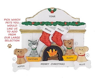 May include: A personalized Christmas ornament featuring a fireplace scene with stockings labeled "Brian" and "Kelly." Includes dog and cat figurines with names "Aspen," "Patches," "Rusty," and "Allie." The ornament has the text "Merry Christmas."