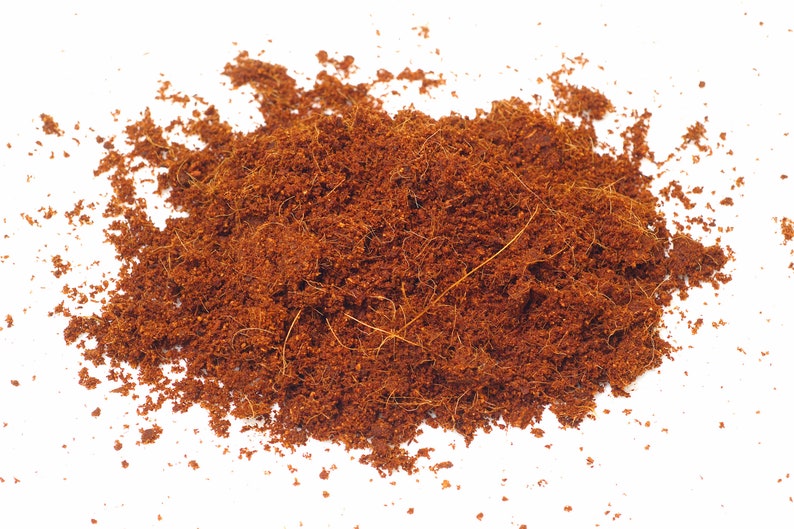 May include: A close-up of a pile of brown coconut coir, a natural fiber used for gardening and other purposes.