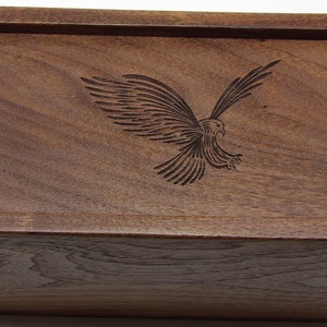 walnut wood, dove tailed, sliding top box with laser engraved bird.