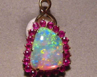 3.6 ct. Opal & Ruby Pendant 18 k Yellow gold