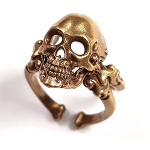 Decorative adjustable Cross bone skull Ring.