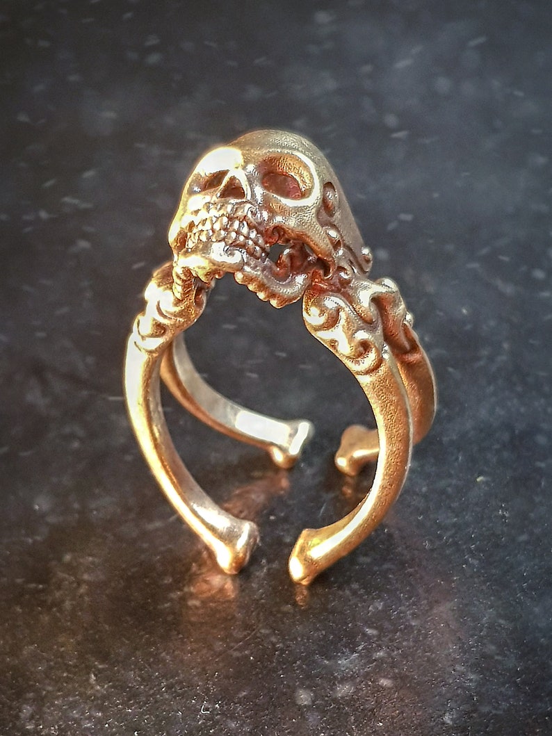 Decorative adjustable Cross bone skull Ring.