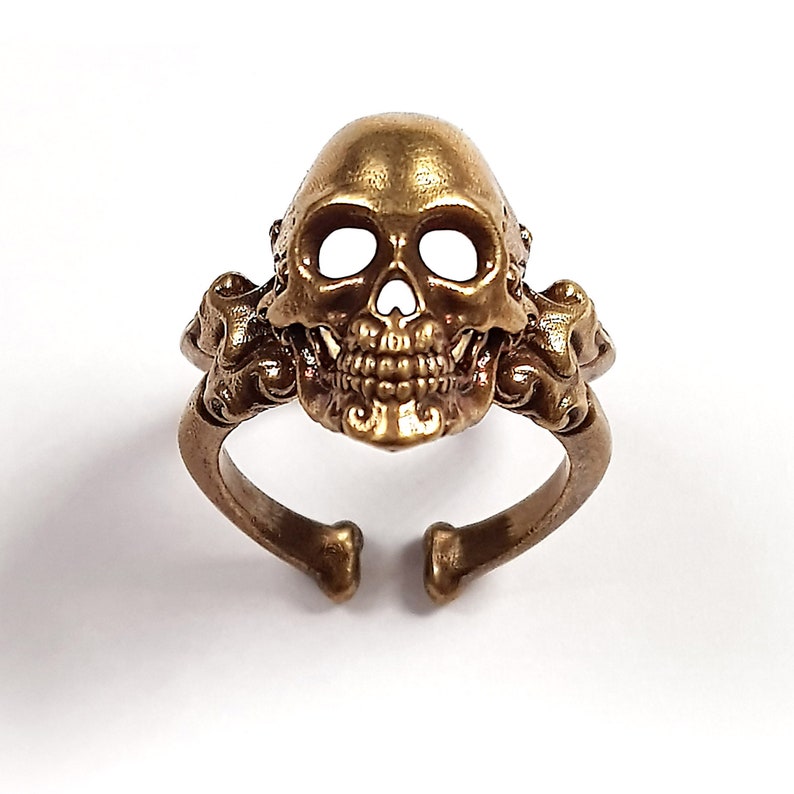 Decorative adjustable Cross bone skull Ring.