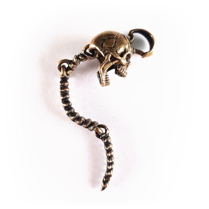 Skull Skeleton pendant with spine with 4 moving parts.