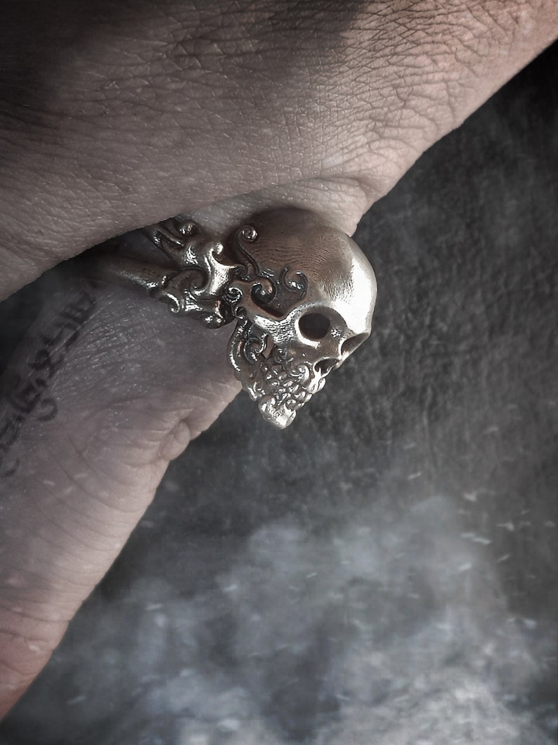 Decorative adjustable Cross bone skull Ring.